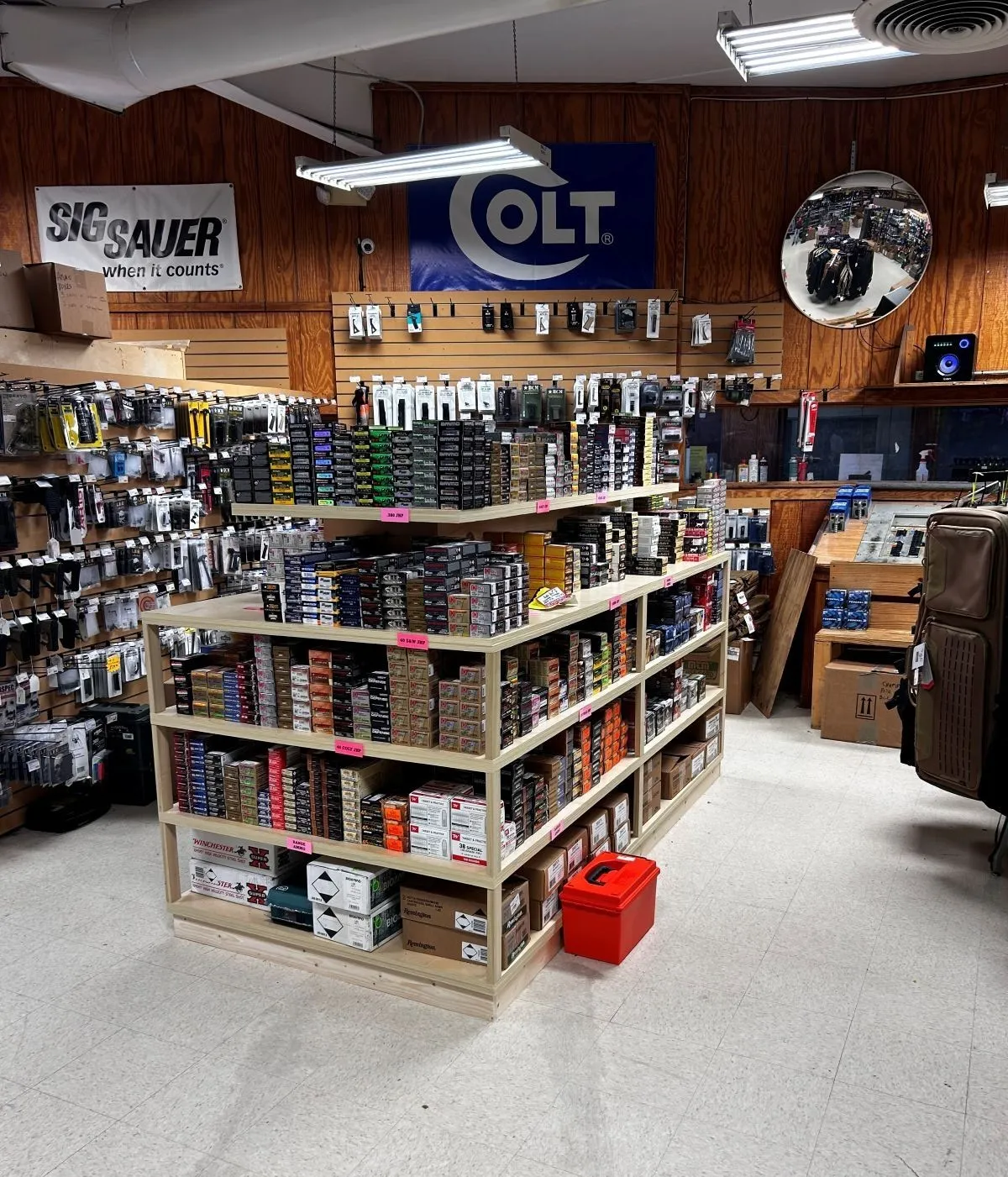 Custom-built retail shelving unit stocked with tools and ammo in Virginia Beach hardware store
