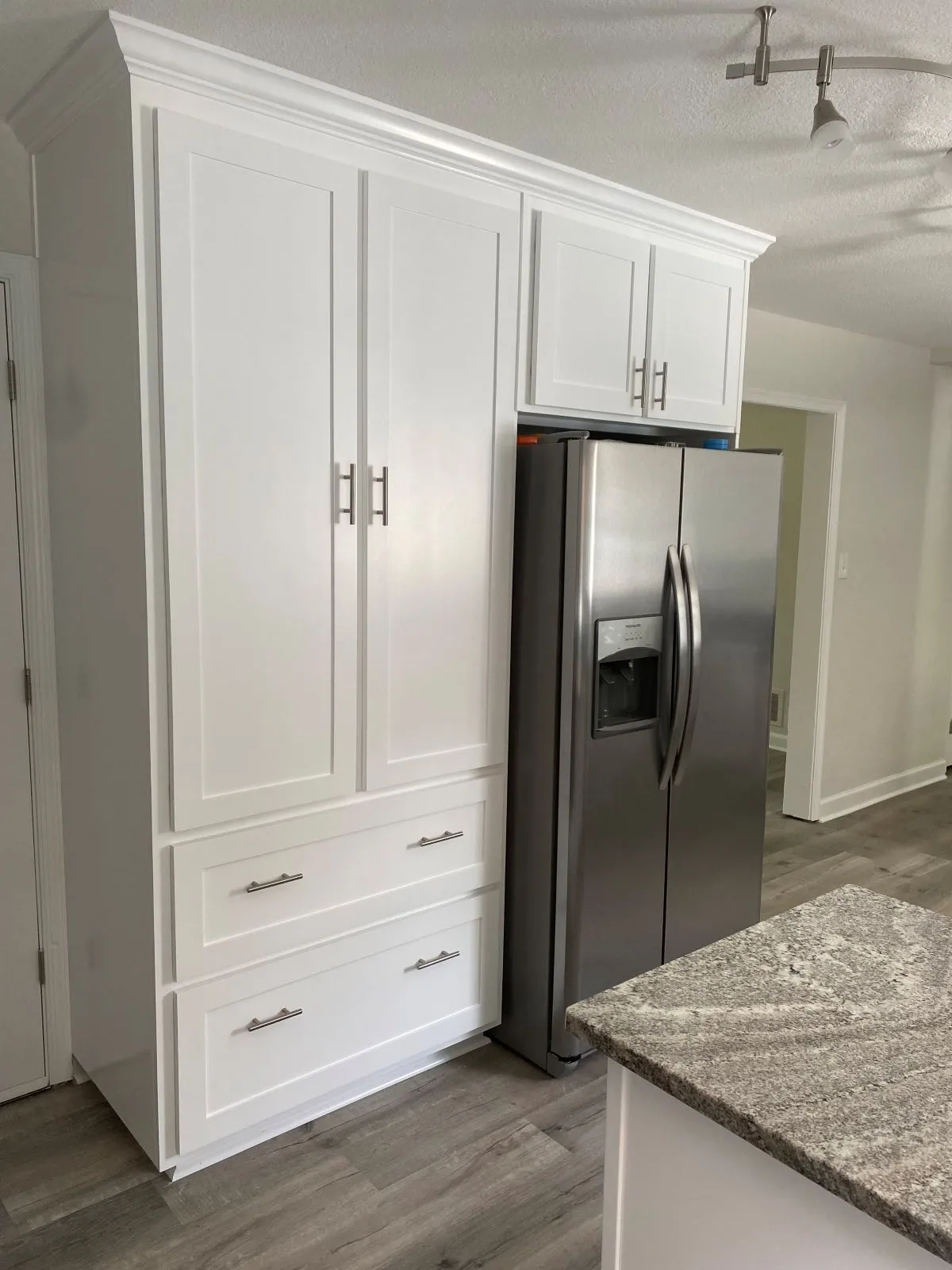 Floating bathroom vanity with under-mirror lighting and black fixtures