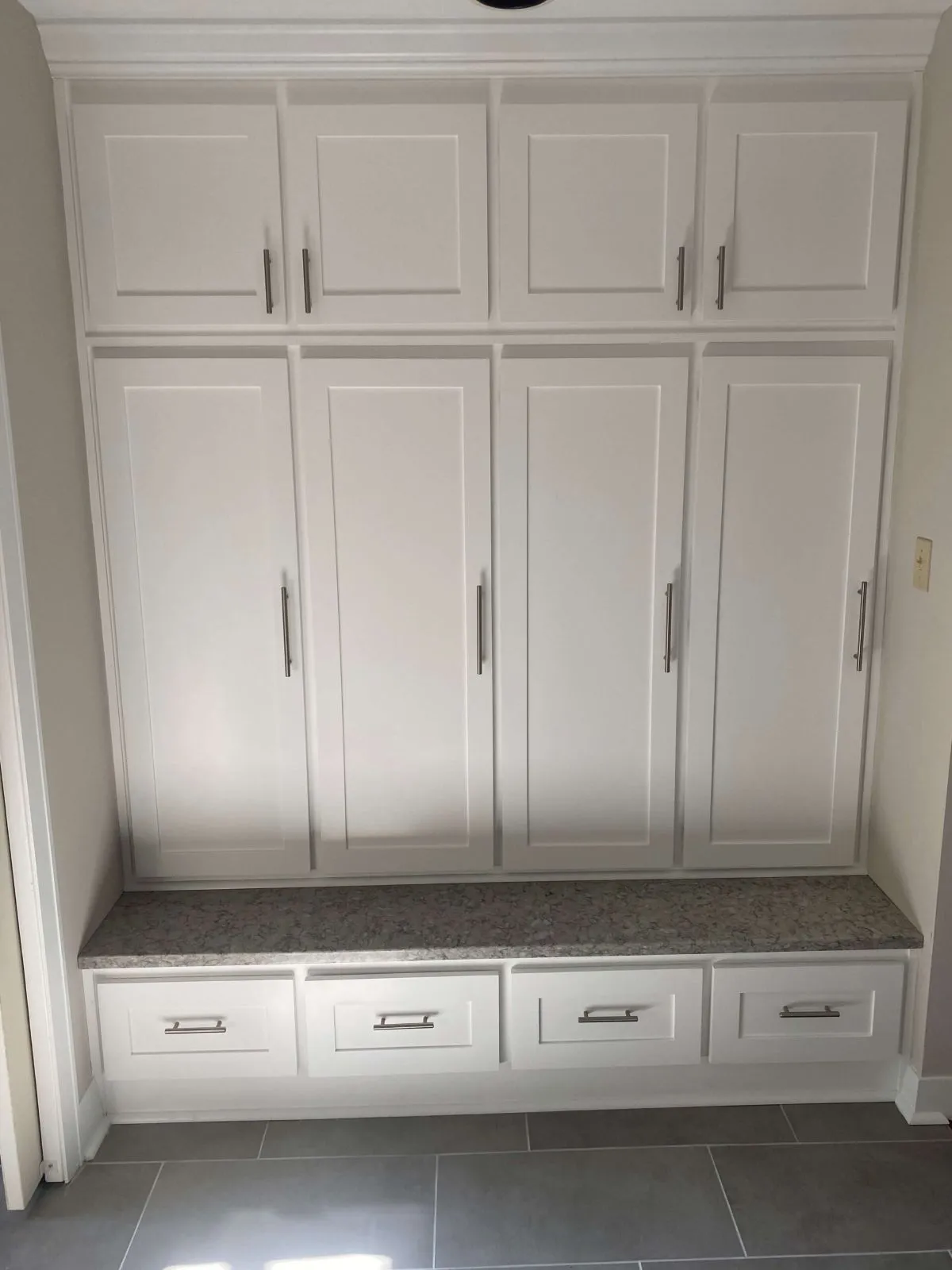 Built-in white cabinets installed in Virginia Beach home hallway