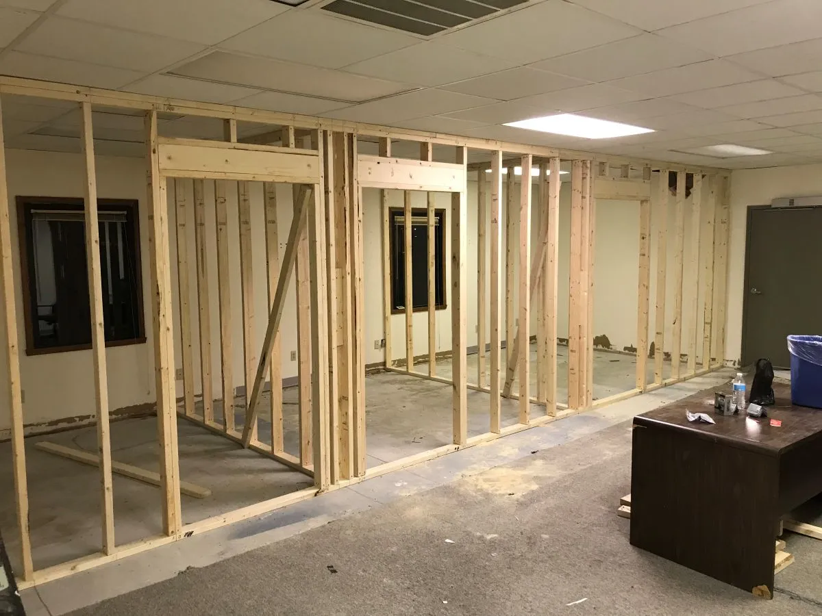 New interior wall framed with studs during remodeling project in Virginia Beach