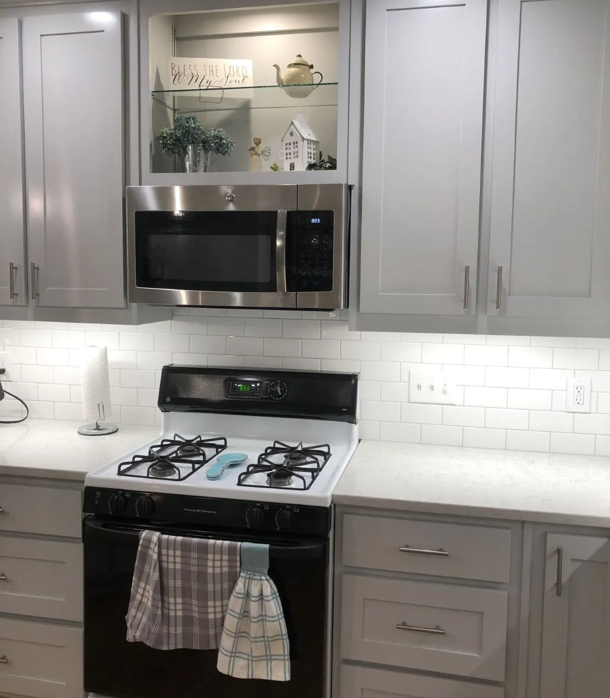 After: expanded layout with stainless appliances and tile flooring