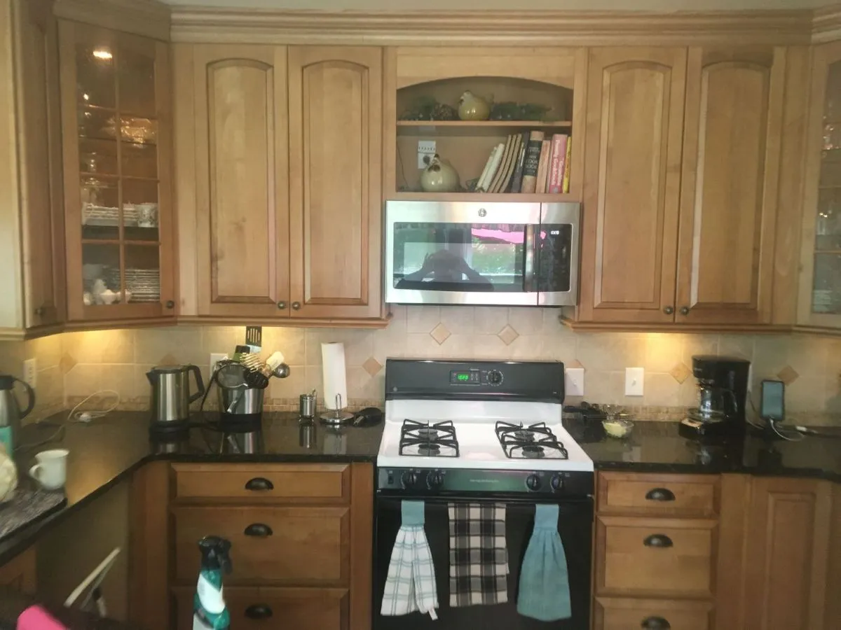 Before: small kitchen with linoleum and outdated appliances