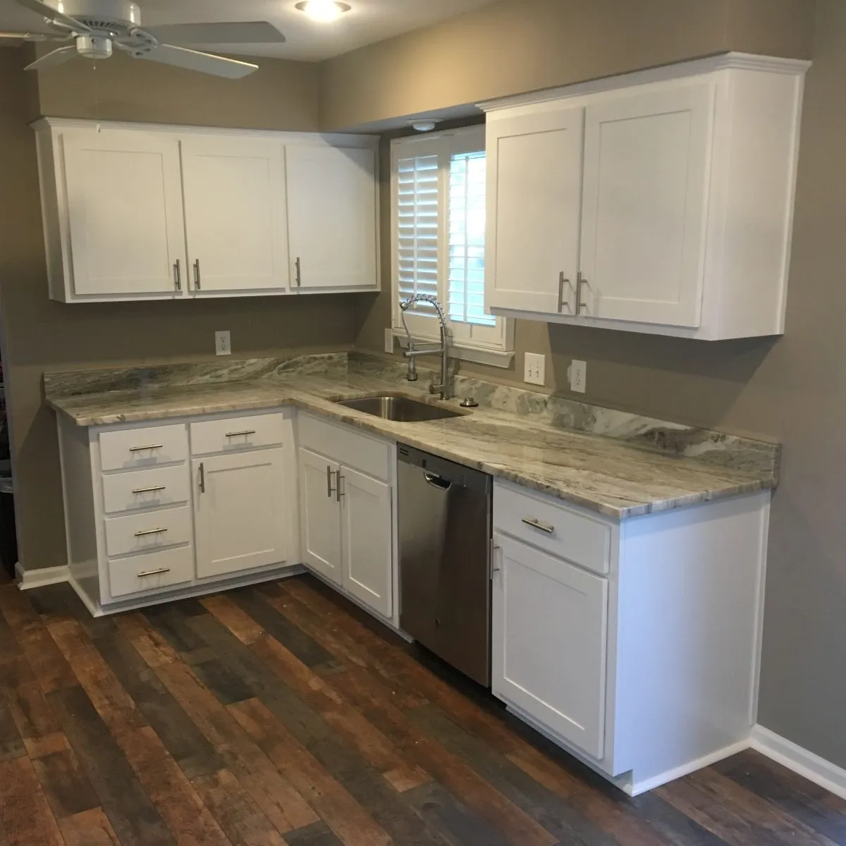 Transitional kitchen with wraparound island and modern fixtures
