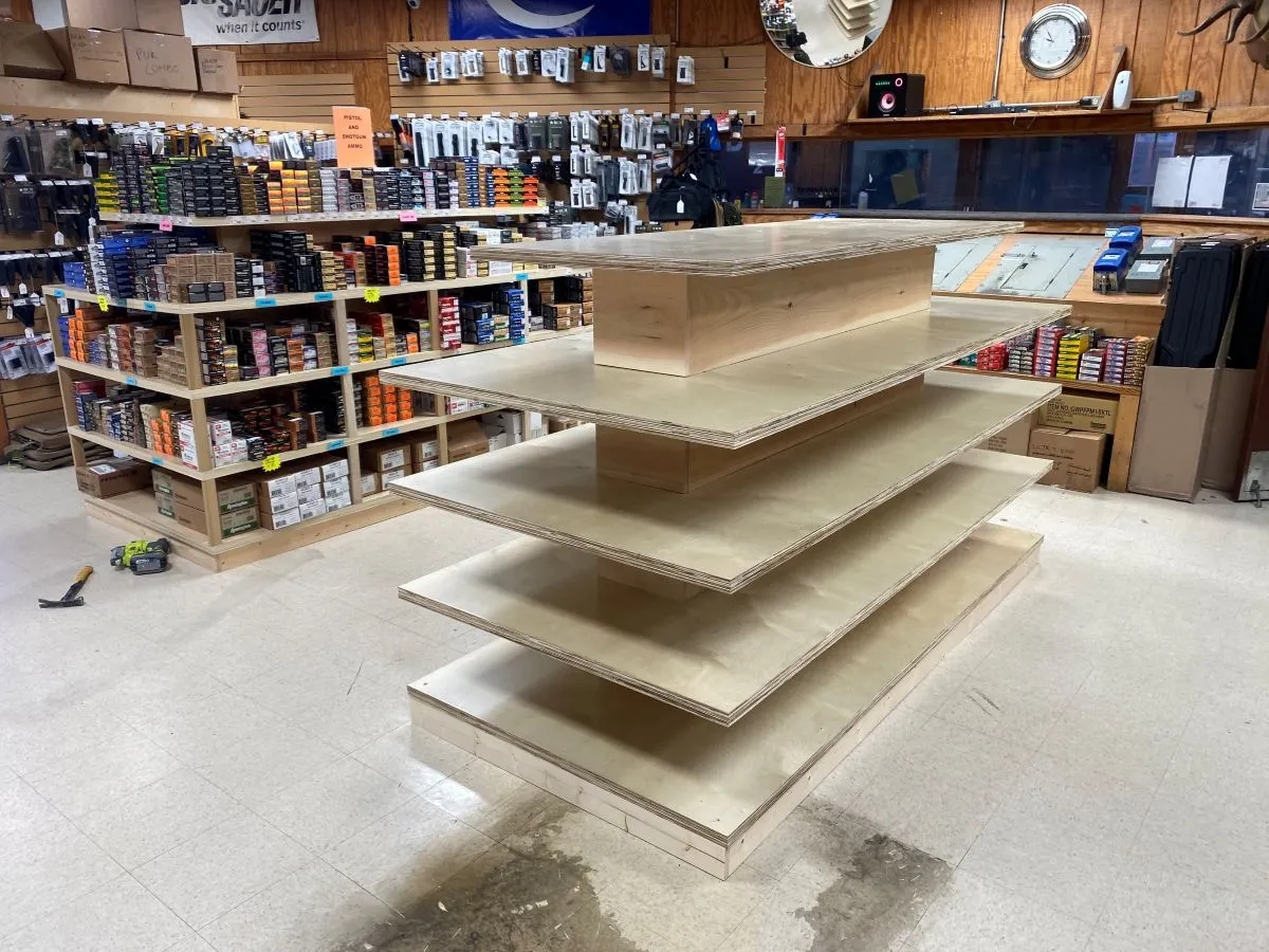 Custom plywood retail display built with tiered shelving for hardware store inventory