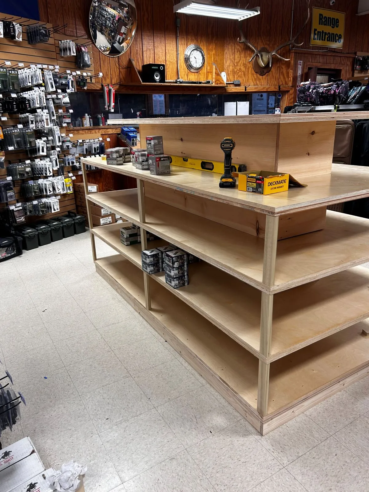 Handmade store shelving with adjustable compartments and wide center workspace